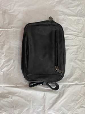 Tumi clutch/travel bag, new condition.