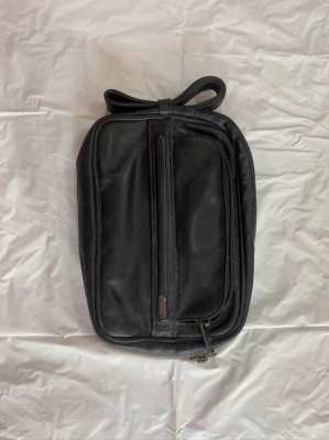 Tumi clutch/travel bag, new condition.