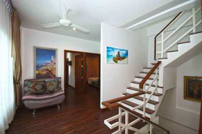   A three-story, fully-furnished town house style property located jus