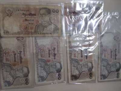 Selling a coin for His Majesty the King's 88th Birthday and banknotes