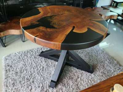 Artistic Matt black river log dining table unique and beautiful