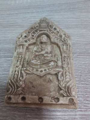 A old Thai plaque showing a monk