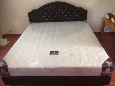 REDUCED....King size bed with a high quality  mattress......Like  NEW 