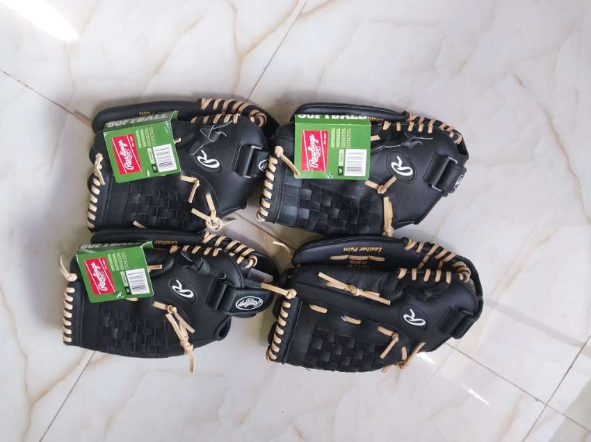 New Rawlings Softball gloves. 3 each. 