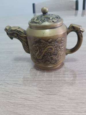 Beautifull bronze teapot decorated with dragons