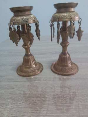 A pair of old Indian candle holders