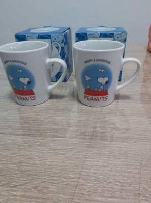 Two boxed snoopy cups by united feature syndicate